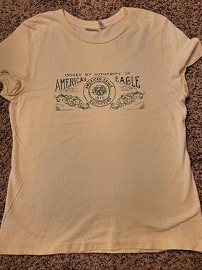 American Eagle Outfitters Pale Yellow Tee with Green Logo